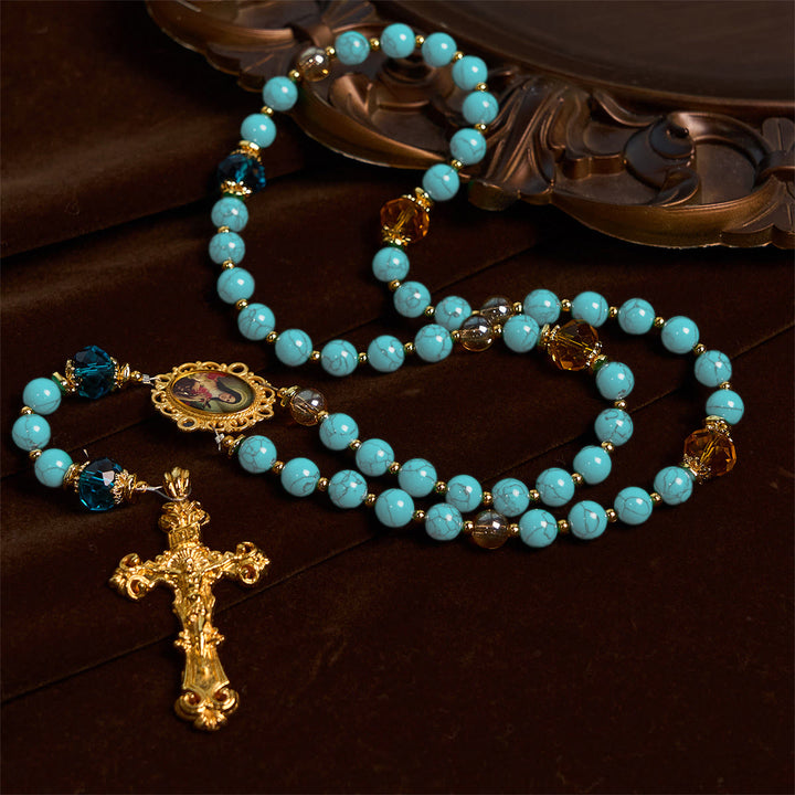Christianartworkshop Rosario artesanal de turquesa y aleación de oro con crucifijo y medalla de Santa Teresa: Un vínculo espiritual lleno de gracia. - Crucifijo y Medalla de Santa Teresa - image 0