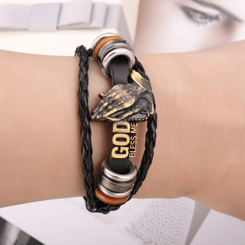 Christianartworkshop Pulsera estilo retro con manos rezando y la inscripción "DIOS ME BENDIGA", diseño trenzado negro. - image 1
