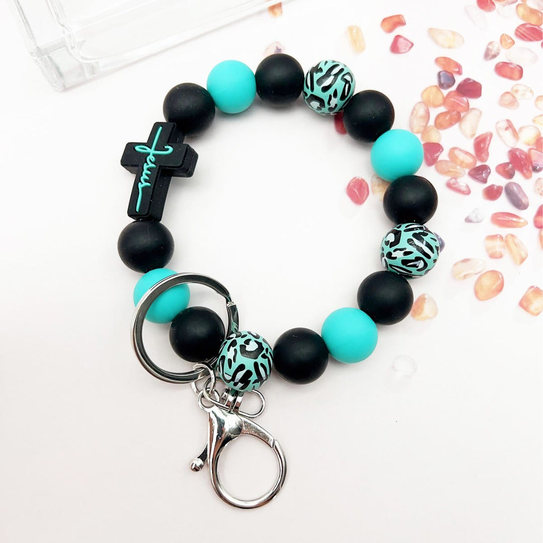 Christianartworkshop Llavero de rosario con dije de cruz de silicona y cuentas de madera con estampado de leopardo: devoción portátil para llevar a todas partes. - Negro - image 0