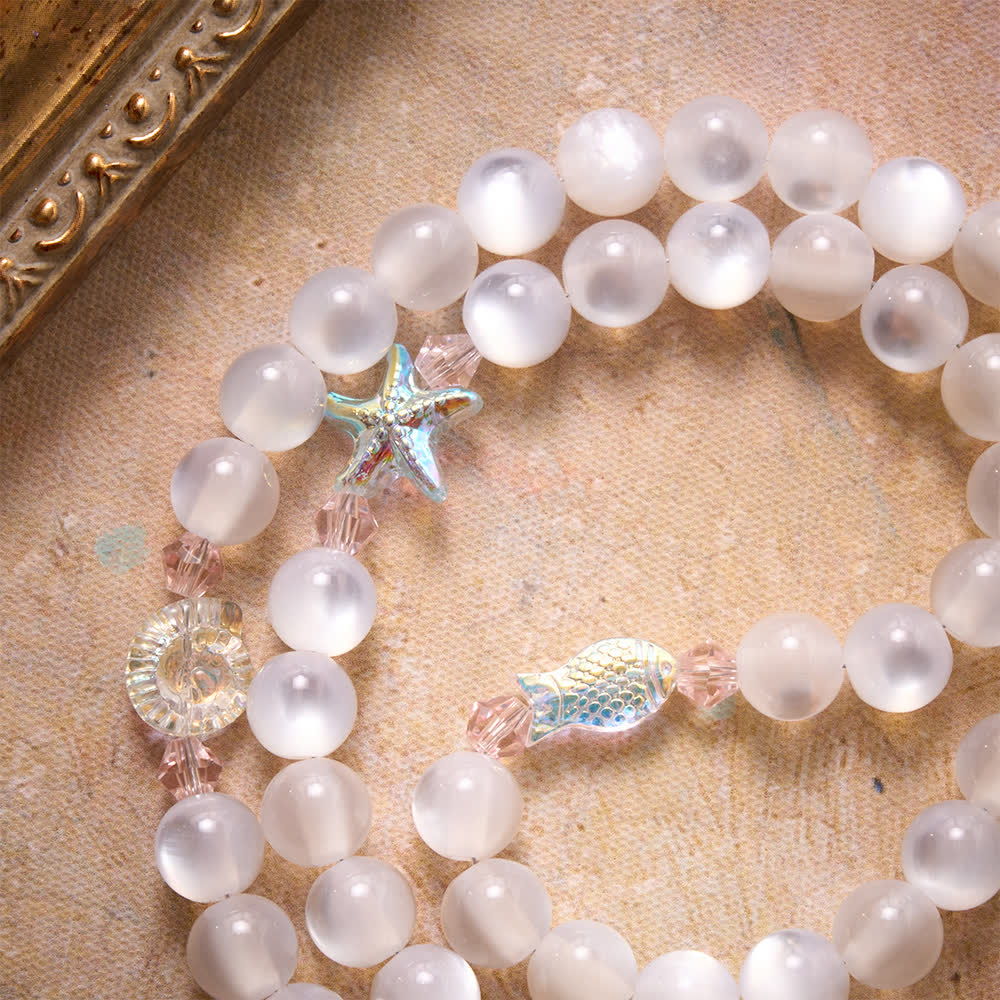 Christianartworkshop Rosario con cuentas mate esmeriladas con temática oceánica veraniega y dijes de cristal de estrellas de mar y peces. - image 5