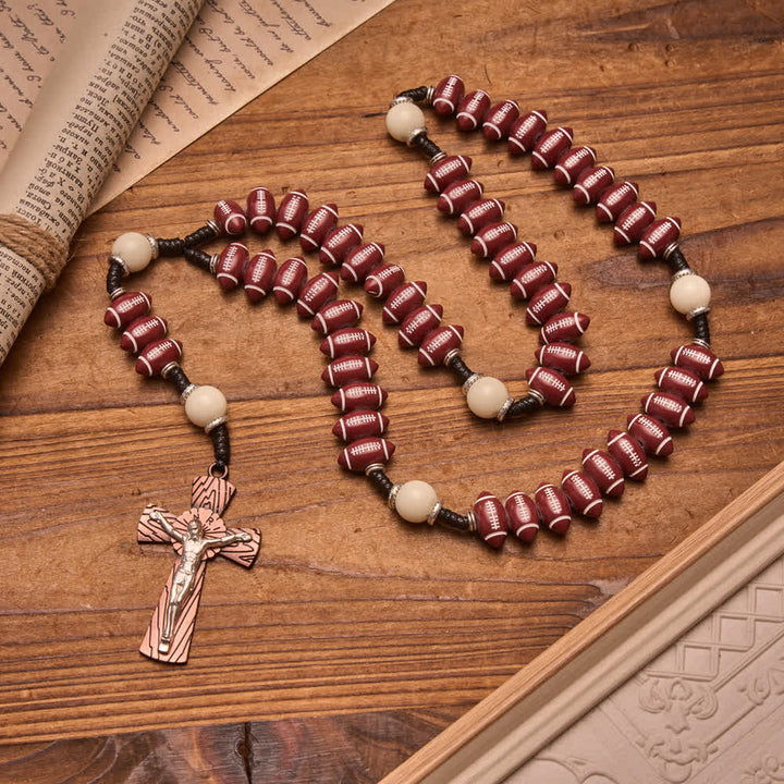 Christianartworkshop Rosario de rugby con cuentas moldeadas y cordón anudado, con crucifijo de vetas de madera: emblema de la valiente perseverancia celestial. - Rosario con temática de rugby - image 0