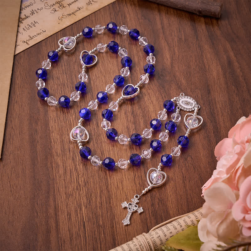 Christianartworkshop Rosario de cristal con forma de corazón hueco y cuentas facetadas de color azul intenso: símbolo de protección divina permanente. - Rosario de cuentas en forma de corazón azul profundo - image 0