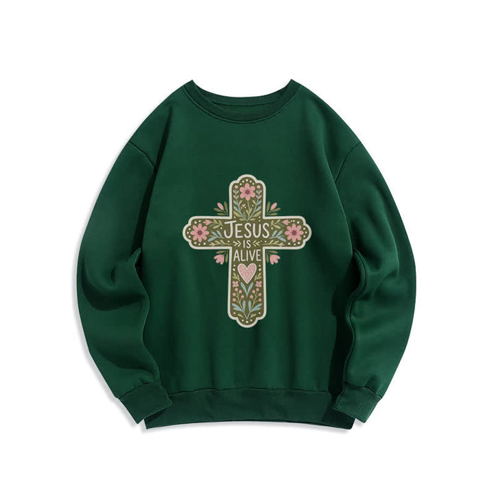 Christianartworkshop Sudadera cómoda de cuello redondo con cruz floral "Jesús está vivo" - Verde - 2XL - image 0